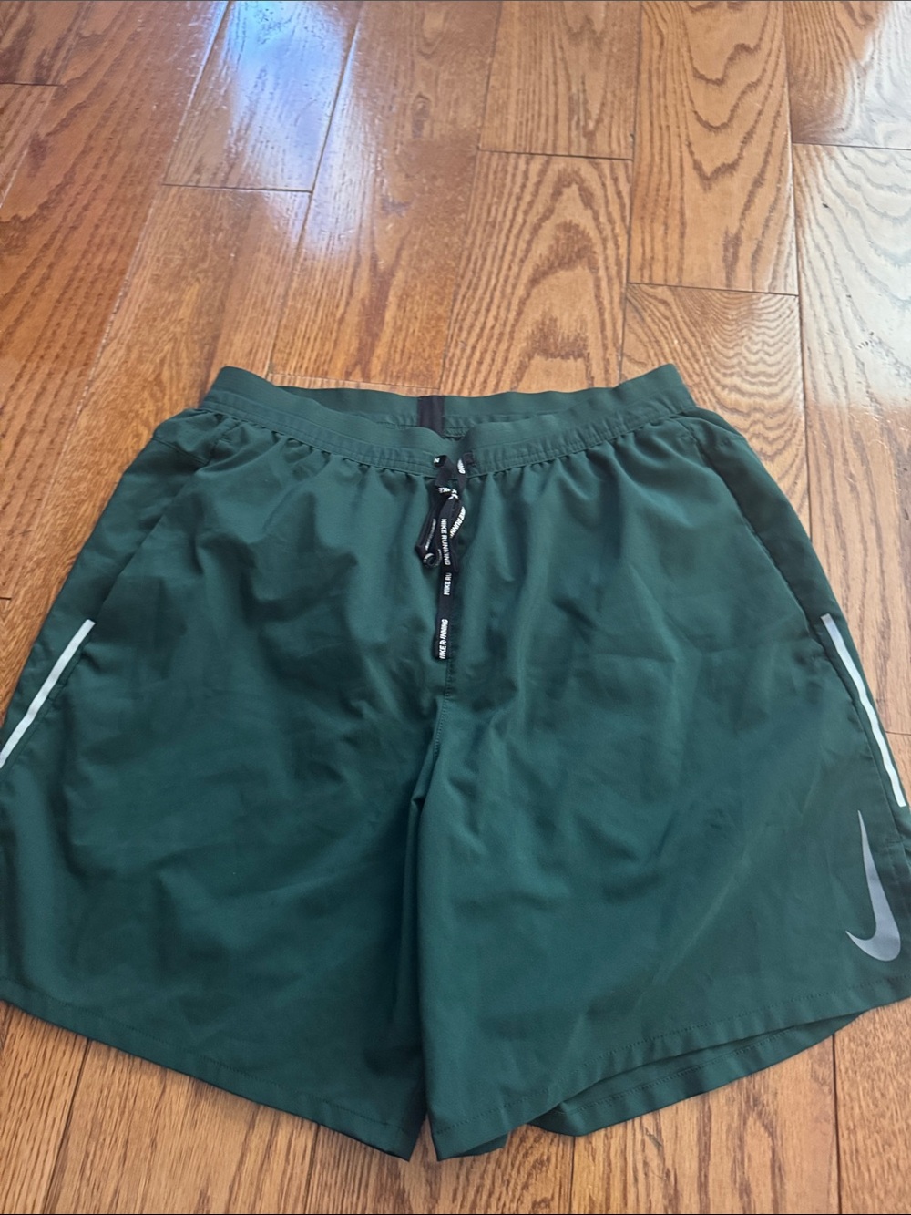 Nike Dark Green Running Shorts with Reflective Accents